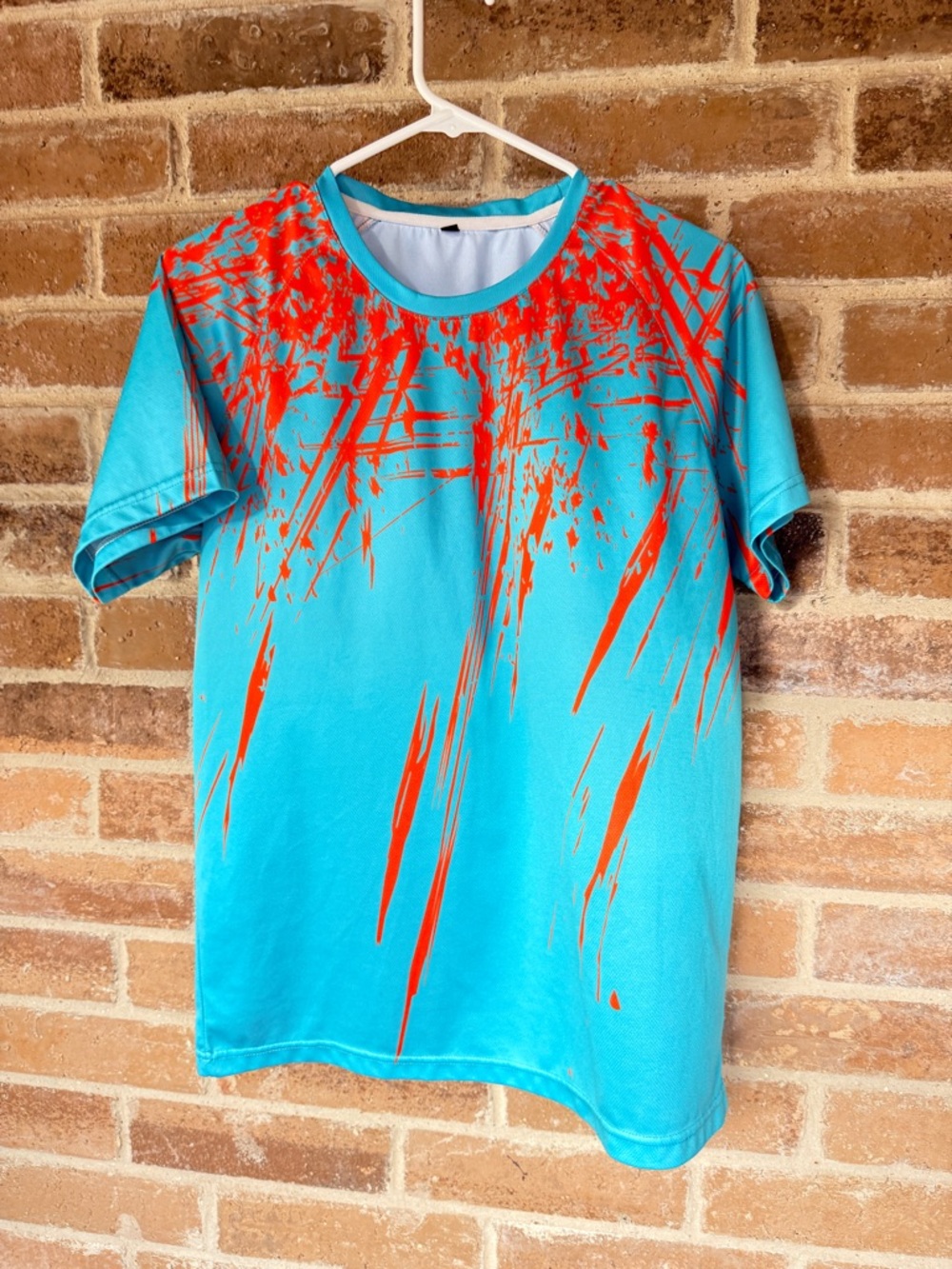Men's Turquoise Short Sleeve Tee with Red Splash Graphic